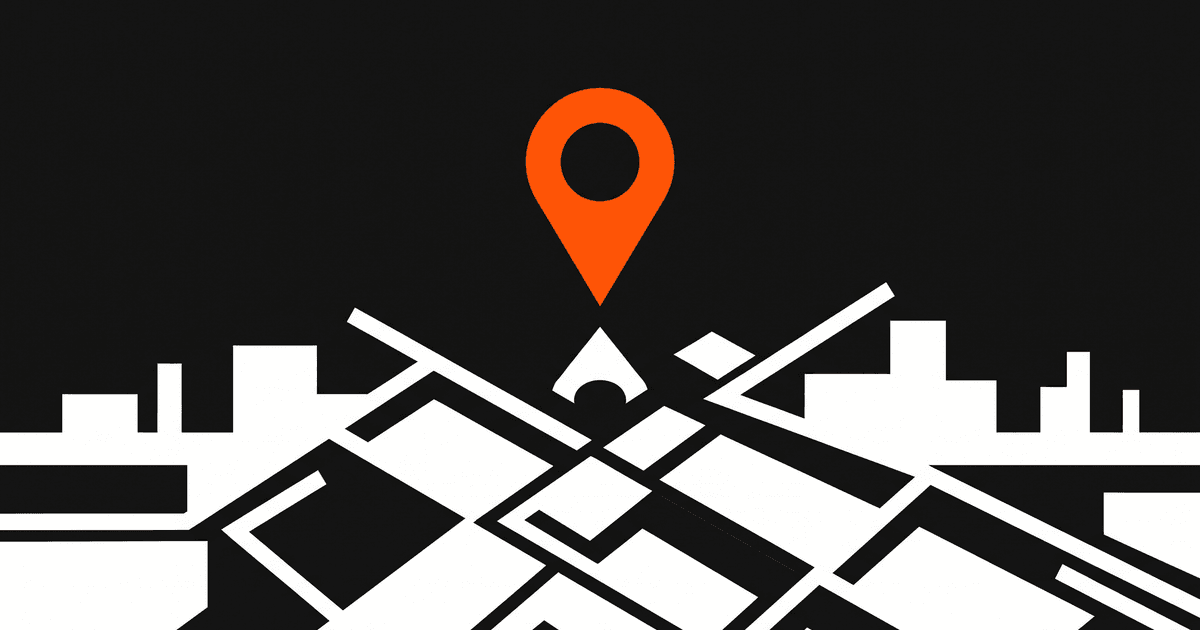 An orange location pin over a white geometric street grid and skyline.